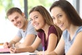 Three students looking at you at classroom