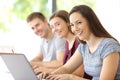 Three students looking at you at classroom Royalty Free Stock Photo