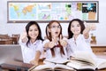 Three students showing thumbs up Royalty Free Stock Photo