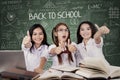 Three students shows thumbs up Royalty Free Stock Photo