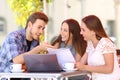 Three students studying and learning in a coffee shop Royalty Free Stock Photo