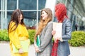 Three students talk and laugh at the university. Education concept, friendship and group of people Royalty Free Stock Photo