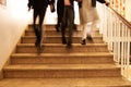 three students walking down the stairs at school Royalty Free Stock Photo