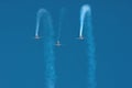 Three stunt planes flying in formation towards camera