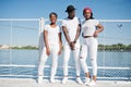 Three stylish african american friends, wear on white