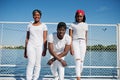 Three stylish african american friends, wear on white