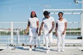 Three stylish african american friends, wear on white Royalty Free Stock Photo