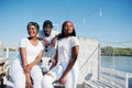 Three stylish african american friends, wear on white Royalty Free Stock Photo