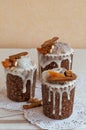 Three stylish homemade traditional Orthodox Easter delicious cakes on the white napkins decorated by dried bananas, orange