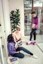 Three stylish students revising info before final examination Royalty Free Stock Photo