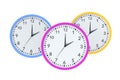 Three stylish wall clocks isolated on white background