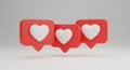 Three Red Social Media Like Notification Icons with White Hearts Floating on a Light Gray Background Royalty Free Stock Photo