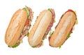 Three submarine sandwiches on white background Royalty Free Stock Photo