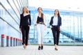 Three successful women left the office. Concept for business, boss, robot, team and success