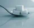 Sugar cubes on a spoon Royalty Free Stock Photo