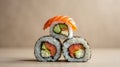Three Sushi Rolls Placed at the Points of an Equilateral Triangle on a Muted Taupe Background Royalty Free Stock Photo