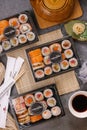Three sushi on the table, top view. Multiple sushi dishes