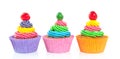 Three sweet colorful cupcakes