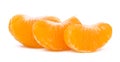 Three sweet juicy mandarin slices Isolated on white background. Royalty Free Stock Photo