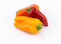 Three sweet orange, red and yelllow peppers on white background