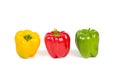 Three sweet Yellow, Red, Green paprika Peppers on white Royalty Free Stock Photo