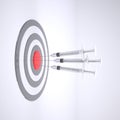 Three syringe with bull`s eye on white background