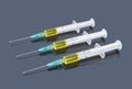 Three syringes with yellow vaccine on dark Royalty Free Stock Photo