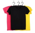 Three t-shirt template on hange isolated on white Royalty Free Stock Photo