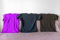 Three T-shirts of different colors. Sportswear. Copy space
