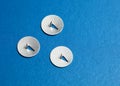 Three tacks on blue Royalty Free Stock Photo