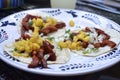 Three tacos al pastor on corn tortillas