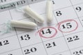 Three tampons on the menstruation calendar