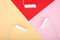 Tampons on yellow, red and pink background