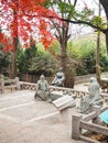 Three taoist stone sculptures in the courtyard of the Taiqing temple Royalty Free Stock Photo