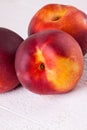 Three tasty fresh ripe juicy nectarines Royalty Free Stock Photo