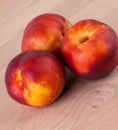 Three tasty fresh ripe juicy nectarines Royalty Free Stock Photo