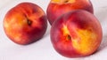 Three tasty fresh ripe juicy nectarines Royalty Free Stock Photo