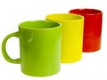 Three tea cups. Red, Yellow and Green.