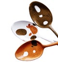 Three teaspoons are painted in different colors with acrylic paint Royalty Free Stock Photo