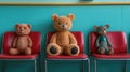 Three teddy bears sitting in red chairs in a waiting room Royalty Free Stock Photo