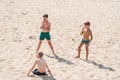 Three teenage boys on the beach