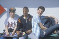 Three teenage boys posing for a picture