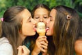 Three teenage friends sharing ice cream