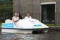 Three teenage girls having fun in a pedal boat