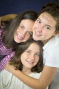 Three teenage girls hugging Royalty Free Stock Photo