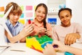 Three teenage kids modeling topographical relief