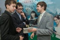 Three teenage teenage school students discuss educational material at the youth technical creativity festival