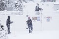 Three teenagers play in the snowstorm in Lexington, MA on January 23, 2023