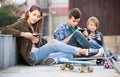 Three teenagers with smartphones in outdoors Royalty Free Stock Photo