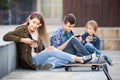 Three teenagers with smartphones in outdoors Royalty Free Stock Photo